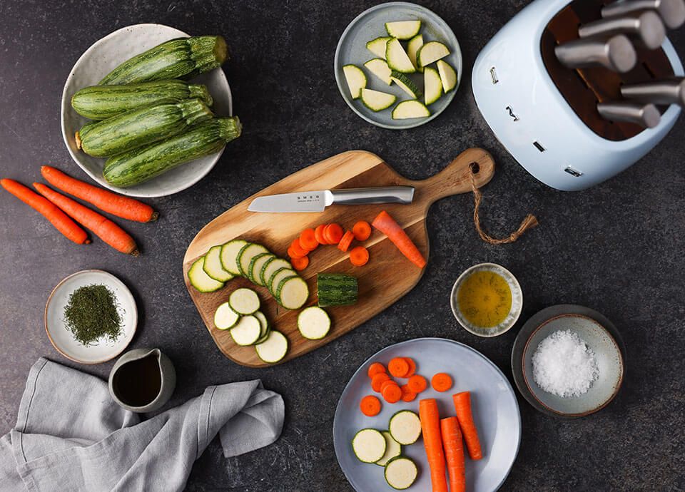 Smeg knife with carrots and cucumber