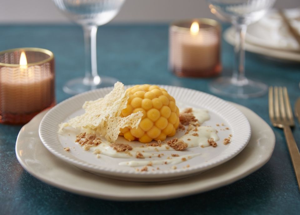 Flan di zucca con fonduta di Parmigiano Reggiano, chips e amaretto