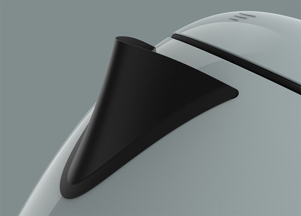 Detail of the black spout on the kettle in colour shade green. The matte black spout is positioned on the upper-left side of the kettle.