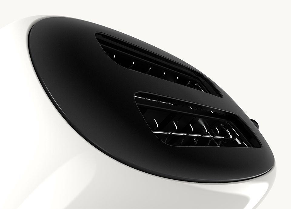 Detail of the upper part of the toaster in colour carrara white where it's visible the slots for the bread slices.