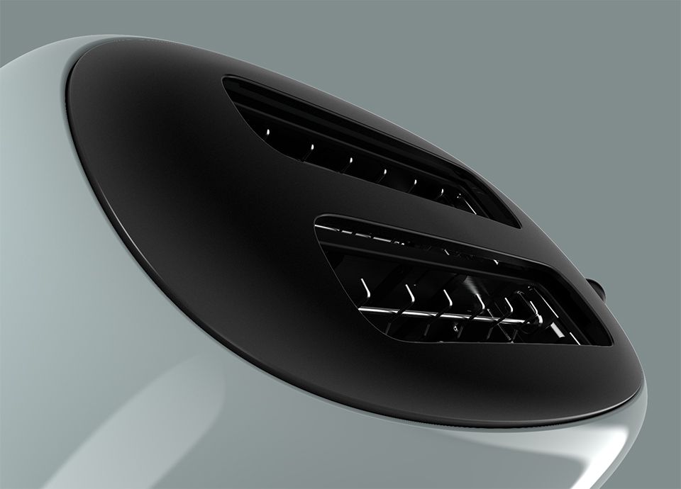 Detail of the upper part of the toaster in colour shade green where it's visible the slots for the bread slices.