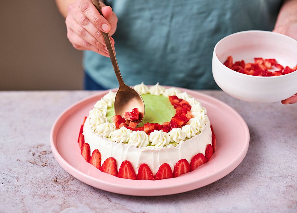 Matcha tea sponge cake with fresh lime cheese cream and strawberry jam